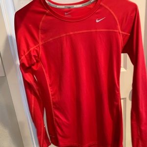 Red women’s long sleeve Nike running top